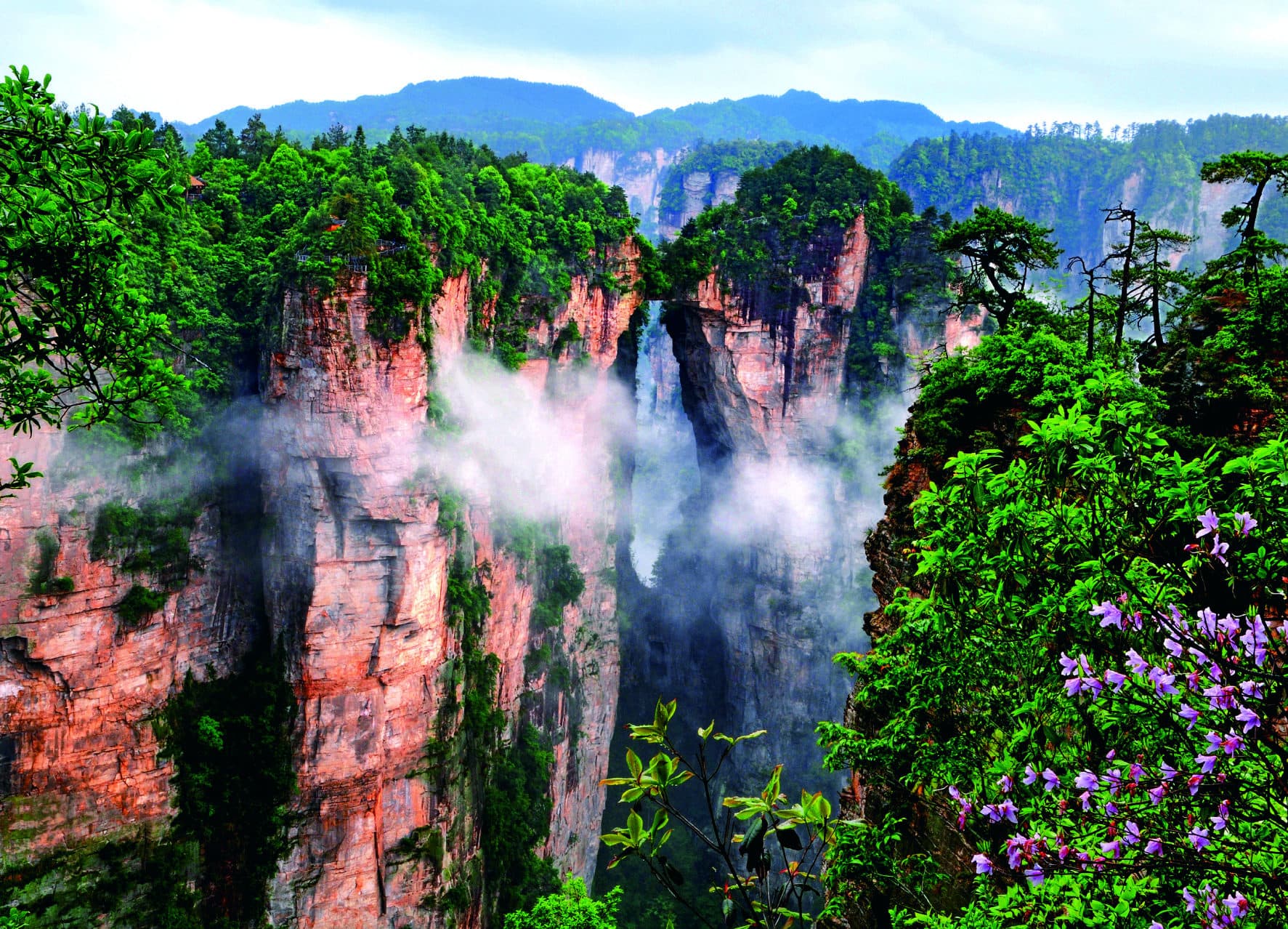 Natural stone bridge between sandstone cliffs in Yuanjiajie