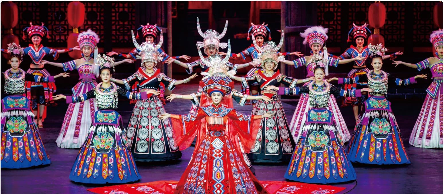 Charming Xiangxi stage performance documented in the official Tour Guide Manual.