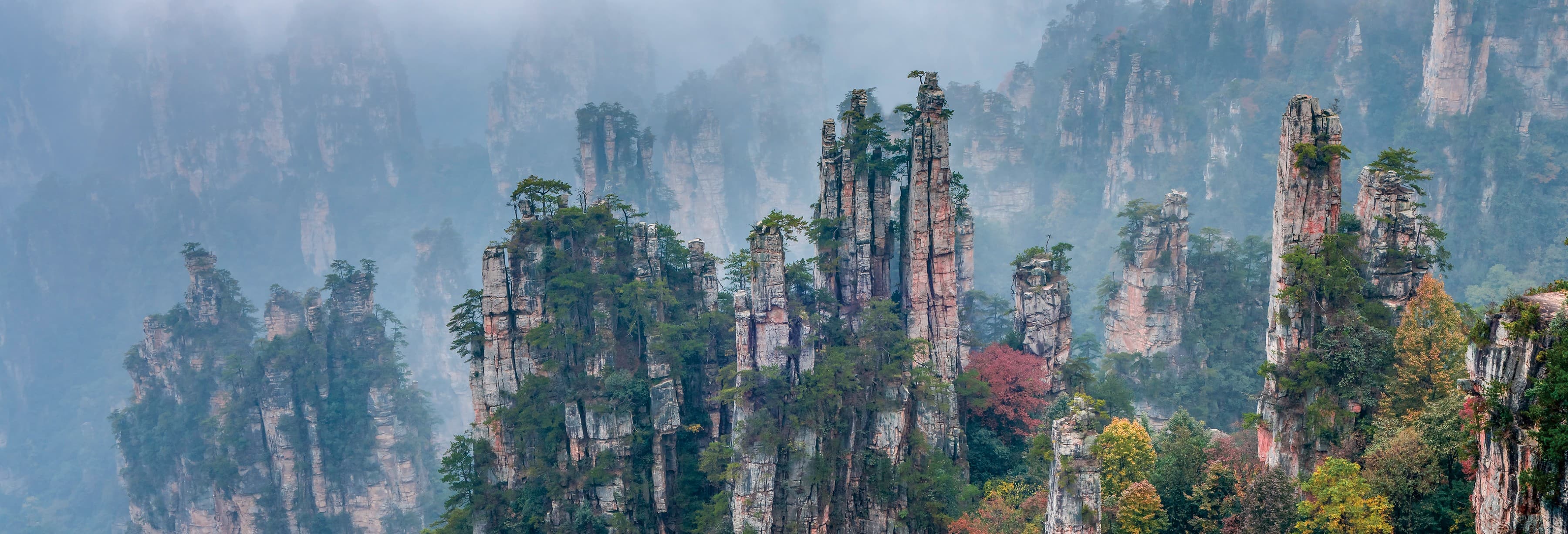 Sandstone pillars in the must-visit scenic areas section of the official Tour Guide Manual.