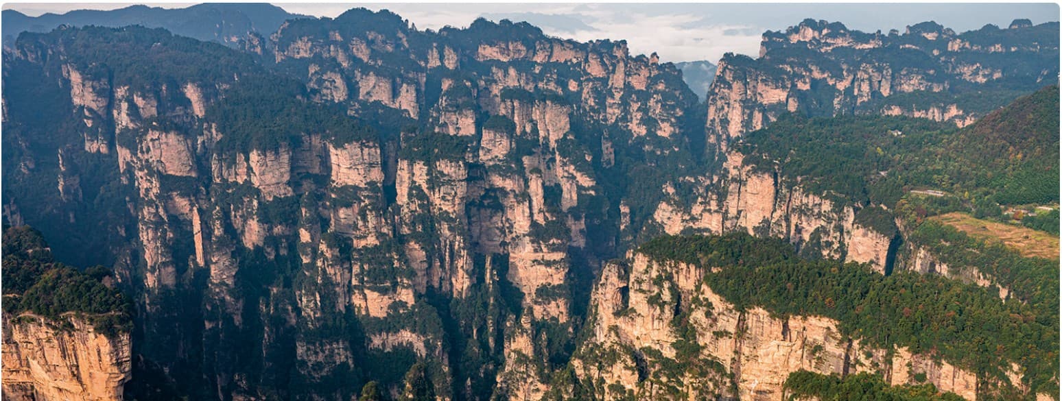 Yuanjiajie sandstone pillars documented in the official Tour Guide Manual.